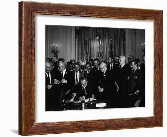 President Lyndon Johnson, Watched by Martin Luther King, Jr. Signing Civil Rights Act, July 2, 1964-null-Framed Photo