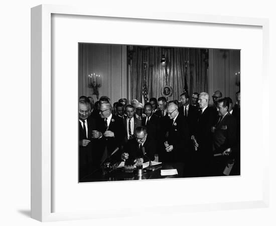 President Lyndon Johnson, Watched by Martin Luther King, Jr. Signing Civil Rights Act, July 2, 1964-null-Framed Photo