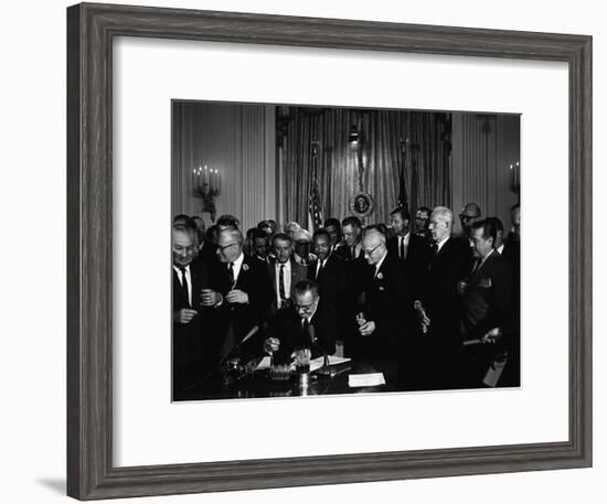 President Lyndon Johnson, Watched by Martin Luther King, Jr. Signing Civil Rights Act, July 2, 1964-null-Framed Photo