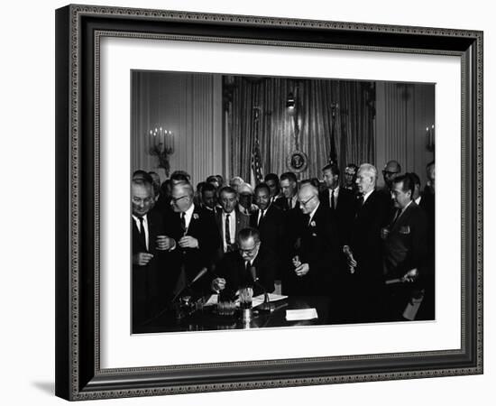 President Lyndon Johnson, Watched by Martin Luther King, Jr. Signing Civil Rights Act, July 2, 1964-null-Framed Photo