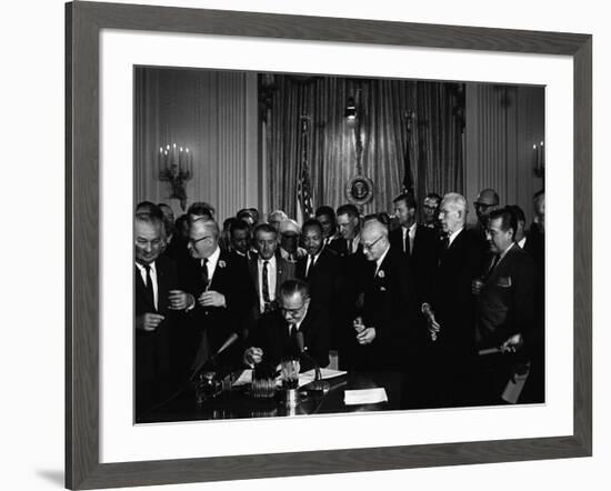 President Lyndon Johnson, Watched by Martin Luther King, Jr. Signing Civil Rights Act, July 2, 1964-null-Framed Photo