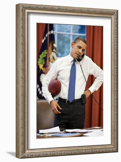 President Obama on the phone with House Speaker John Boehner:Oval Office, April 8, 2011-null-Framed Photo