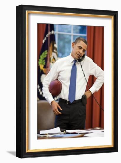 President Obama on the phone with House Speaker John Boehner:Oval Office, April 8, 2011-null-Framed Photo