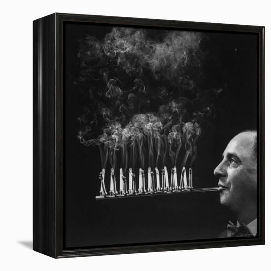 President of Zeus Corp, Robert L. Stern, Smoking Cigarettes from His Self Designed Cigarette Holder-Yale Joel-Framed Premier Image Canvas