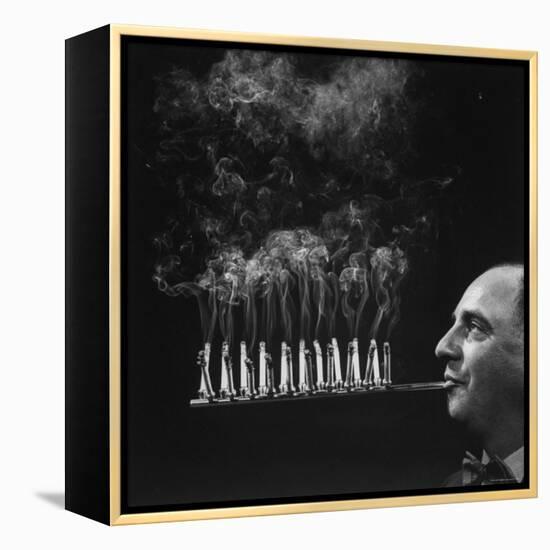 President of Zeus Corp, Robert L. Stern, Smoking Cigarettes from His Self Designed Cigarette Holder-Yale Joel-Framed Premier Image Canvas