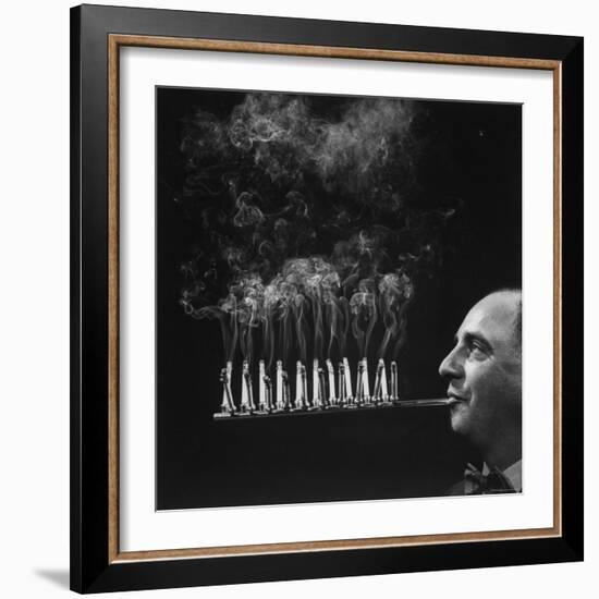 President of Zeus Corp, Robert L. Stern, Smoking Cigarettes from His Self Designed Cigarette Holder-Yale Joel-Framed Photographic Print