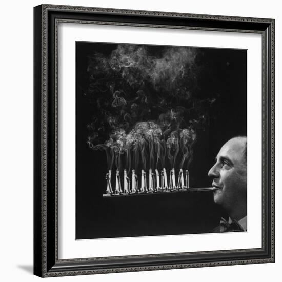 President of Zeus Corp, Robert L. Stern, Smoking Cigarettes from His Self Designed Cigarette Holder-Yale Joel-Framed Photographic Print