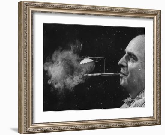 President of Zeus Corp., Robert Stern, Smoking from Self-Designed "Rainy Day" Cigarette Holder-Yale Joel-Framed Photographic Print