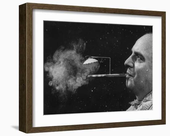 President of Zeus Corp., Robert Stern, Smoking from Self-Designed "Rainy Day" Cigarette Holder-Yale Joel-Framed Photographic Print