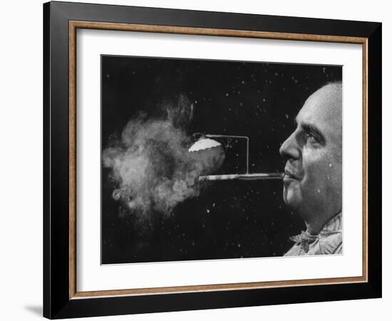 President of Zeus Corp., Robert Stern, Smoking from Self-Designed "Rainy Day" Cigarette Holder-Yale Joel-Framed Photographic Print