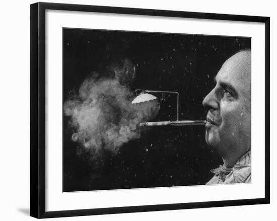 President of Zeus Corp., Robert Stern, Smoking from Self-Designed "Rainy Day" Cigarette Holder-Yale Joel-Framed Photographic Print