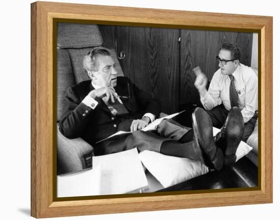 President Richard Nixon and Henry Kissinger Talking on Air Force One-null-Framed Stretched Canvas