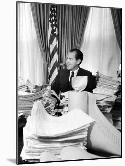 President Richard Nixon Sitting Among Stacks of Telegrams Supporting His Vietnam Policy-null-Mounted Photo
