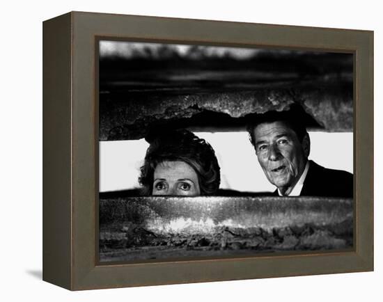 President Ronald Reagan and First Lady Nancy Reagan Peer out of a World War II Bunker-null-Framed Premier Image Canvas