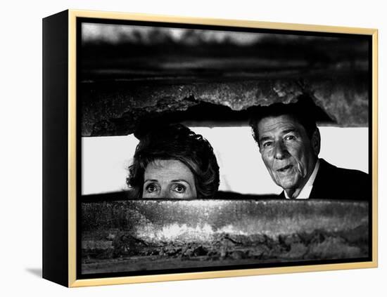 President Ronald Reagan and First Lady Nancy Reagan Peer out of a World War II Bunker-null-Framed Premier Image Canvas