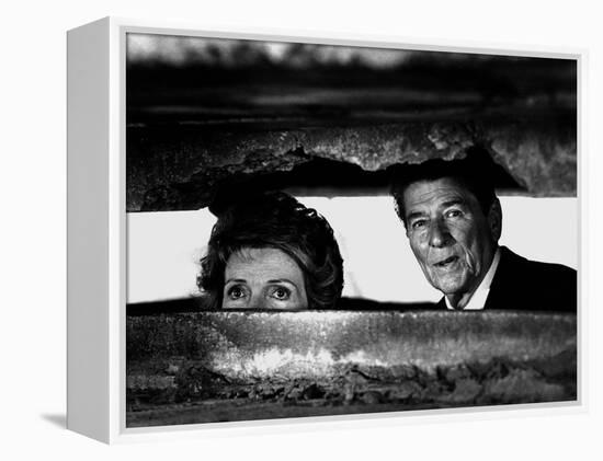 President Ronald Reagan and First Lady Nancy Reagan Peer out of a World War II Bunker-null-Framed Premier Image Canvas