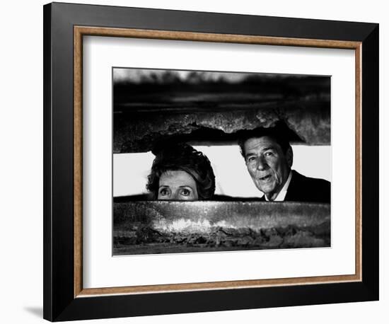 President Ronald Reagan and First Lady Nancy Reagan Peer out of a World War II Bunker-null-Framed Photographic Print