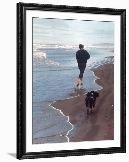 Presidential Candidate Bobby Kennedy and His Dog, Freckles, Running on Beach-Bill Eppridge-Framed Premium Photographic Print