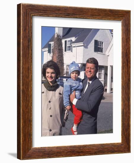 Presidential Candidate John F. Kennedy Holding Daughter with Wife Outside Home on Election Day-Paul Schutzer-Framed Photographic Print