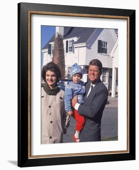 Presidential Candidate John F. Kennedy Holding Daughter with Wife Outside Home on Election Day-Paul Schutzer-Framed Photographic Print