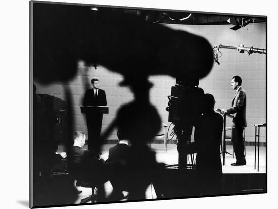 Presidential Candidates Senator John Kennedy and Richard Nixon Standing at Lecterns Debating-Paul Schutzer-Mounted Photographic Print