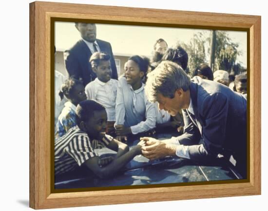 Presidential Contender Bobby Kennedy Stops During Campaigning to Shake Hands African American Boy-Bill Eppridge-Framed Premier Image Canvas