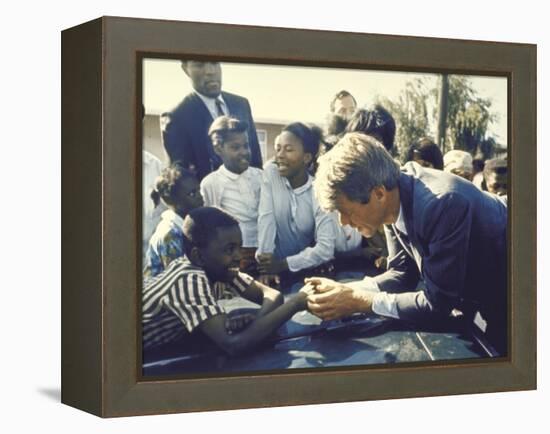 Presidential Contender Bobby Kennedy Stops During Campaigning to Shake Hands African American Boy-Bill Eppridge-Framed Premier Image Canvas