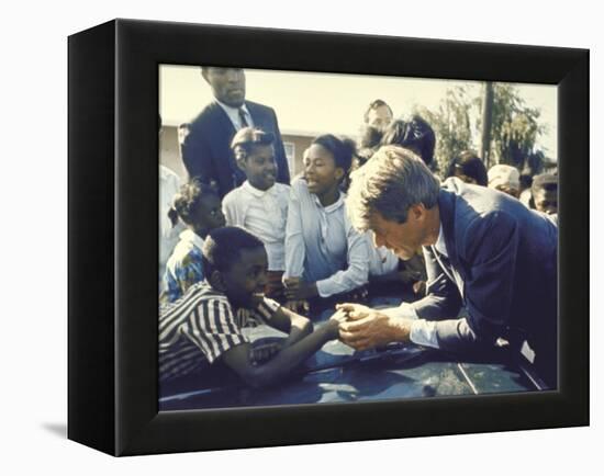 Presidential Contender Bobby Kennedy Stops During Campaigning to Shake Hands African American Boy-Bill Eppridge-Framed Premier Image Canvas