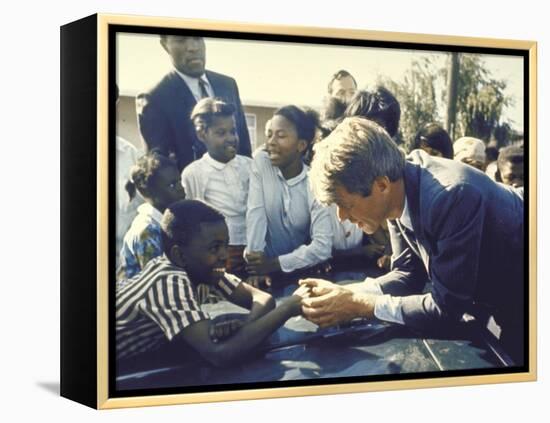 Presidential Contender Bobby Kennedy Stops During Campaigning to Shake Hands African American Boy-Bill Eppridge-Framed Premier Image Canvas