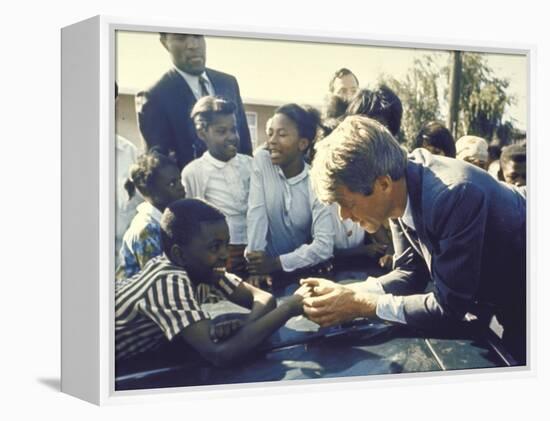 Presidential Contender Bobby Kennedy Stops During Campaigning to Shake Hands African American Boy-Bill Eppridge-Framed Premier Image Canvas
