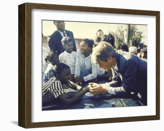 Presidential Contender Bobby Kennedy Stops During Campaigning to Shake Hands African American Boy-Bill Eppridge-Framed Photographic Print