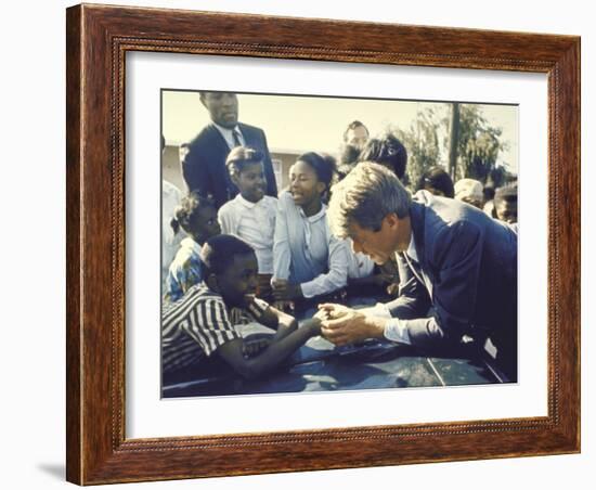 Presidential Contender Bobby Kennedy Stops During Campaigning to Shake Hands African American Boy-Bill Eppridge-Framed Photographic Print
