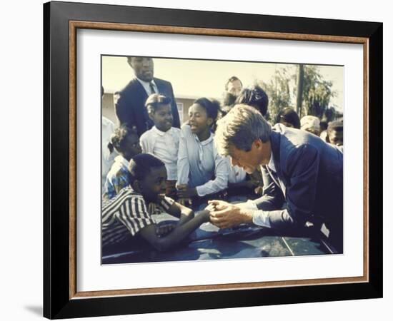 Presidential Contender Bobby Kennedy Stops During Campaigning to Shake Hands African American Boy-Bill Eppridge-Framed Photographic Print