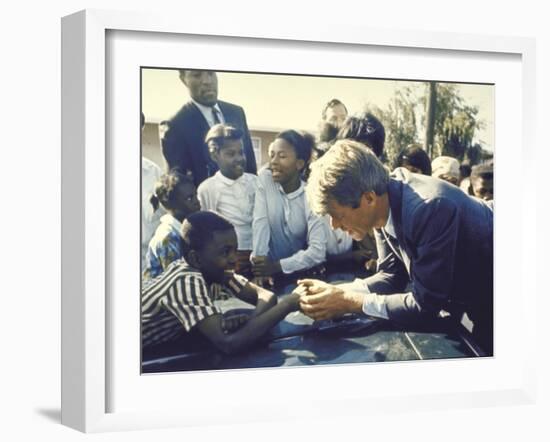 Presidential Contender Bobby Kennedy Stops During Campaigning to Shake Hands African American Boy-Bill Eppridge-Framed Photographic Print