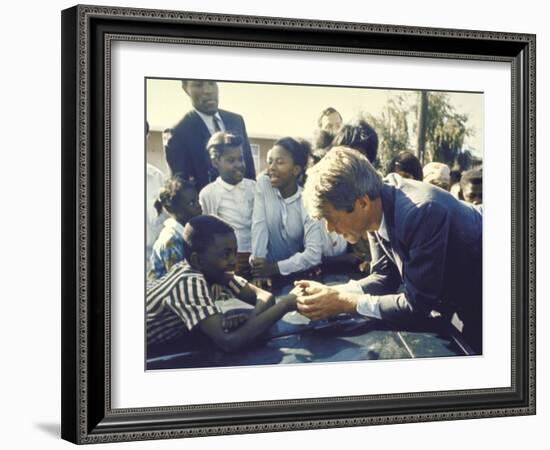 Presidential Contender Bobby Kennedy Stops During Campaigning to Shake Hands African American Boy-Bill Eppridge-Framed Photographic Print