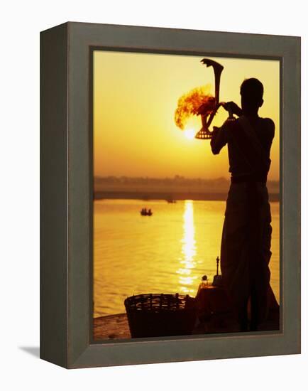 Priest Moves Lantern in Front of Sun During Morning Puja on Ganga Ma, Varanasi, India-Anthony Plummer-Framed Premier Image Canvas