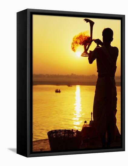 Priest Moves Lantern in Front of Sun During Morning Puja on Ganga Ma, Varanasi, India-Anthony Plummer-Framed Premier Image Canvas