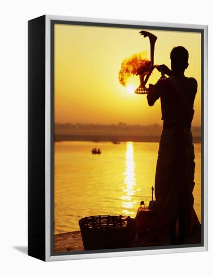 Priest Moves Lantern in Front of Sun During Morning Puja on Ganga Ma, Varanasi, India-Anthony Plummer-Framed Premier Image Canvas