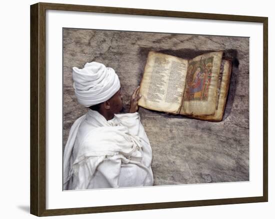 Priest of Ethiopian Orthodox Church Reads Old Bible at Rock-Hewn Church of Yohannes Maequddi-Nigel Pavitt-Framed Photographic Print