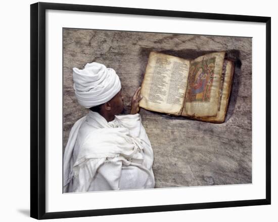Priest of Ethiopian Orthodox Church Reads Old Bible at Rock-Hewn Church of Yohannes Maequddi-Nigel Pavitt-Framed Photographic Print