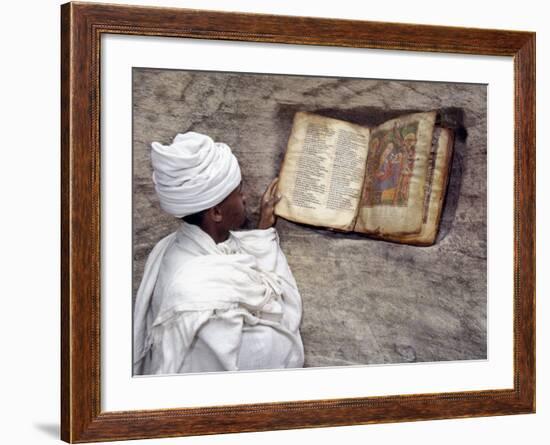 Priest of Ethiopian Orthodox Church Reads Old Bible at Rock-Hewn Church of Yohannes Maequddi-Nigel Pavitt-Framed Photographic Print