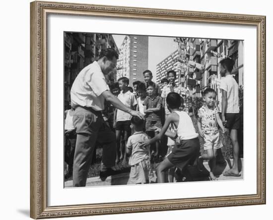 Prime Minister Kuan Yew Lee Talking to Children While Visiting a Housing Project-null-Framed Photographic Print