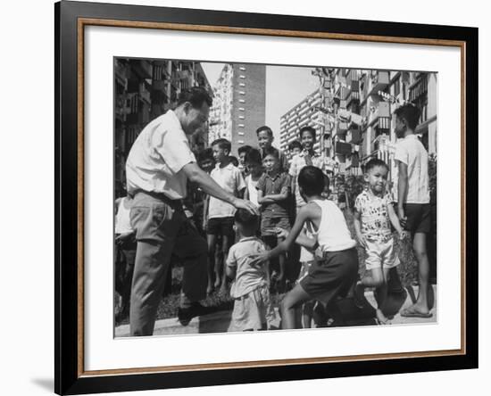 Prime Minister Kuan Yew Lee Talking to Children While Visiting a Housing Project-null-Framed Photographic Print