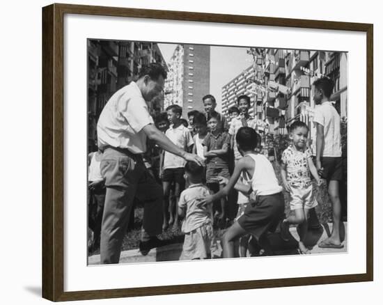 Prime Minister Kuan Yew Lee Talking to Children While Visiting a Housing Project-null-Framed Photographic Print