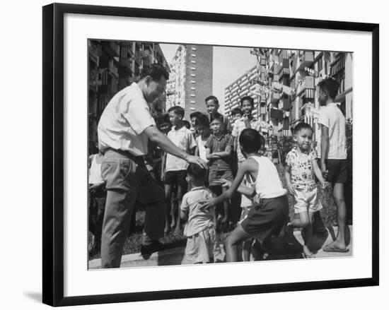 Prime Minister Kuan Yew Lee Talking to Children While Visiting a Housing Project--Framed Photographic Print