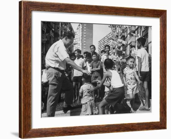 Prime Minister Kuan Yew Lee Talking to Children While Visiting a Housing Project-null-Framed Photographic Print