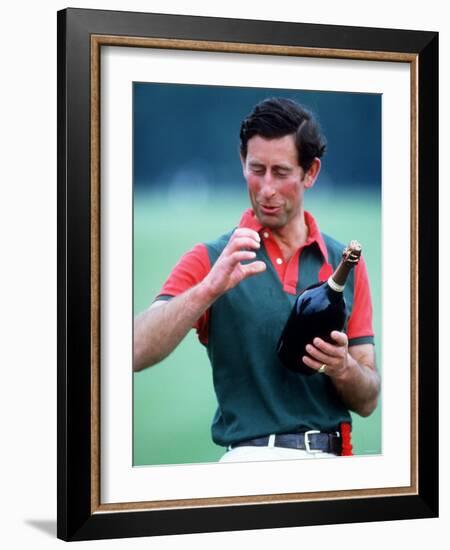 Prince Charles at Polo at Windsor Holding a Bottle of Champange May 1985-null-Framed Photographic Print