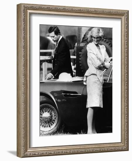 Prince Charles Examining the Bodywork of His Aston Martin-null-Framed Photographic Print