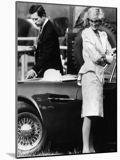 Prince Charles Examining the Bodywork of His Aston Martin-null-Mounted Photographic Print