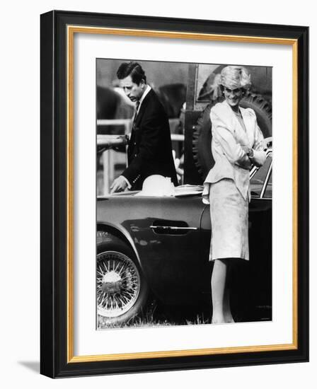 Prince Charles Examining the Bodywork of His Aston Martin-null-Framed Photographic Print